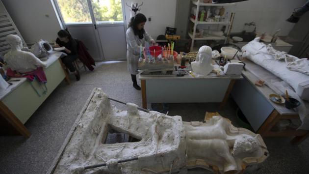 Chosen from fine arts graduates these trained sculptors work on a range of pieces, from a 3-inch hare from Roman-era Macedonia to a 7-foot statue of Zeus, or Poseidon, made in the mid-5th century B.C. and one of the star exhibits of the National Archaeological Museum in Athens. (Thanassis Stavrakis / AP) Chosen from fine arts graduates these trained sculptors work on a range of pieces, from a 3-inch hare from Roman-era Macedonia to a 7-foot statue of Zeus, or Poseidon, made in the mid-5th century B.C. and one of the star exhibits of the National Archaeological Museum in Athens. (Thanassis Stavrakis / AP)