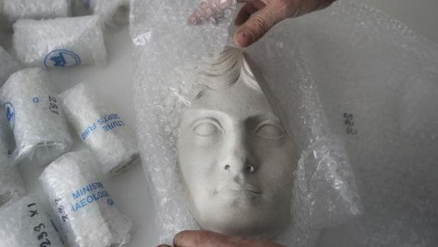 An employee wraps up an ancient sculpture’s replica in the lab. “The standard is very high. And every artist tries to emulate what was done by the artist in ancient times,” supervisor Stelios Gavalas, a sculptor by training, told The Associated Press. “For us, it is a very big honor to have daily contact with works of the great artists of antiquity.” (Thanassis Stavrakis / AP) An employee wraps up an ancient sculpture’s replica in the lab. “The standard is very high. And every artist tries to emulate what was done by the artist in ancient times,” supervisor Stelios Gavalas, a sculptor by training, told The Associated Press. “For us, it is a very big honor to have daily contact with works of the great artists of antiquity.” (Thanassis Stavrakis / AP)