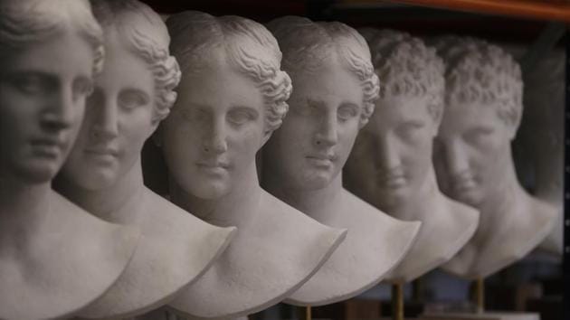 Plaster replicas of Hygeia are placed on a shelf in the lab. Casts are made in the museums where the originals are kept, and the ensuing moulds are stored in the workshop, together with more than a thousand prototype copies, some dating from the late 19th century. (Thanassis Stavrakis / AP) Plaster replicas of Hygeia are placed on a shelf in the lab. Casts are made in the museums where the originals are kept, and the ensuing moulds are stored in the workshop, together with more than a thousand prototype copies, some dating from the late 19th century. (Thanassis Stavrakis / AP)