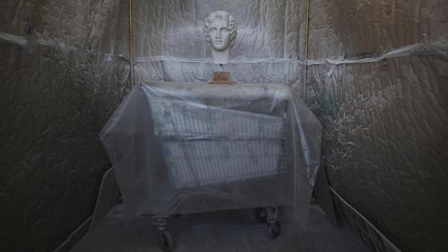 A replica bust of Alexander the Great goes through colour processing. Greek Culture Minister Lydia Koniordou promised at a recent news conference that by this summer they will also be available for online purchase. (Thanassis Stavrakis / AP) A replica bust of Alexander the Great goes through colour processing. Greek Culture Minister Lydia Koniordou promised at a recent news conference that by this summer they will also be available for online purchase. (Thanassis Stavrakis / AP)