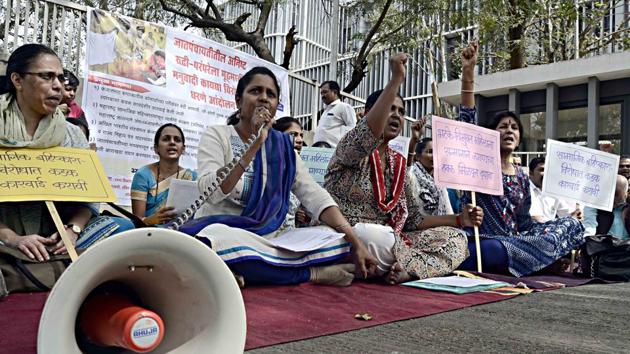 Women’s rights group staged a demonstration at the Pune district Collectorate in Pune on Tuesday.(Ravindra Joshi/HT PHOTO)