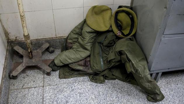 The blood soaked uniform of a policeman lies on the floor outside an operation theater inside a hospital in Srinagar. Two policemen were killed on Tuesday after militants attacked a government-run hospital in Srinagar that allowed a hardened Pakistani terrorist to escape, police said. (Dar Yasin / AP) The blood soaked uniform of a policeman lies on the floor outside an operation theater inside a hospital in Srinagar. Two policemen were killed on Tuesday after militants attacked a government-run hospital in Srinagar that allowed a hardened Pakistani terrorist to escape, police said. (Dar Yasin / AP)
