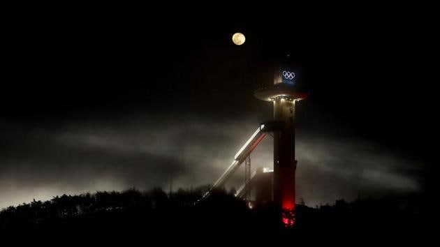 The waning moon rises beyond the Alpensia Ski Jumping Center at the 2018 Winter Olympics in Pyeongchang. South Korea edged out both Germany and France in its bid for hosting rights. (Charlie Riedel / AP) The waning moon rises beyond the Alpensia Ski Jumping Center at the 2018 Winter Olympics in Pyeongchang. South Korea edged out both Germany and France in its bid for hosting rights. (Charlie Riedel / AP)