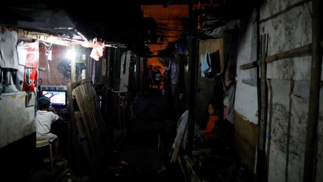 A boy uses a computer at an internet shop in Market 3. Bullet-ridden corpses are found hours or days later, often just a few minutes away, although police deny illegal killings. But frequent police operations and shadowy murders have hit the slum hard and residents say more blood has been spilled since Duterte was elected on the promise to wipe out drugs and crime in six months. (Dondi Tawatao / REUTERS) A boy uses a computer at an internet shop in Market 3. Bullet-ridden corpses are found hours or days later, often just a few minutes away, although police deny illegal killings. But frequent police operations and shadowy murders have hit the slum hard and residents say more blood has been spilled since Duterte was elected on the promise to wipe out drugs and crime in six months. (Dondi Tawatao / REUTERS)
