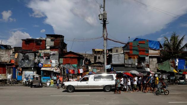 Family and friends of a shooting victim from Market 3 take part in the funeral march along North Bay Boulevard. “Since Duterte came, that’s when there was a rise in killings. It was pitiful, especially so for the many women killed,” said Visitacion Castellano, 73, a long-time resident. “They should have given them years. Put them in jail. But not kill.” (Dondi Tawatao / REUTERS) Family and friends of a shooting victim from Market 3 take part in the funeral march along North Bay Boulevard. “Since Duterte came, that’s when there was a rise in killings. It was pitiful, especially so for the many women killed,” said Visitacion Castellano, 73, a long-time resident. “They should have given them years. Put them in jail. But not kill.” (Dondi Tawatao / REUTERS)