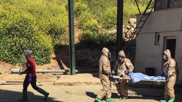 File photo of Turkish experts carrying a victim of alleged chemical weapons attacks in Syrian city of Idlib, at a local hospital in Reyhanli, Hatay, Turkey. (AP) File photo of Turkish experts carrying a victim of alleged chemical weapons attacks in Syrian city of Idlib, at a local hospital in Reyhanli, Hatay, Turkey. (AP)