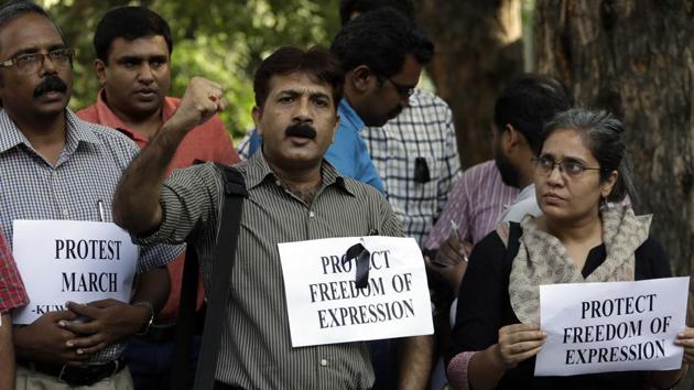 Journalists shout slogans during a protest in New Delhi against the killing of TV journalist Shantanu Bhowmick, who was abducted and killed while covering a protest rally in Tripura .(AP File Photo) Journalists shout slogans during a protest in New Delhi against the killing of TV journalist Shantanu Bhowmick, who was abducted and killed while covering a protest rally in Tripura .(AP File Photo)