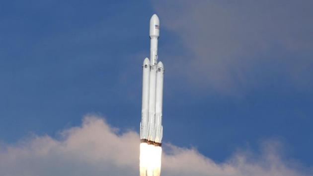 The Falcon Heavy rocket climbs towards space after lifting off from launch pad 39-A at the Kennedy Space Center in Cape Canaveral. The massive rocket fired its 27 engines and rumbled into the blue sky over the same NASA launchpad that served as a base for the US missions to the Moon four decades ago. (Joe Skipper / REUTERS) 