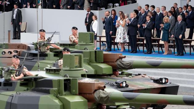 French President Emmanuel Macron, US President Donald Trump and US first lady Melania Trump at the annual Bastille Day military parade in Paris on July 14, 2017. Trump has asked for a similar show in Washington, the White House has said. (AFP File photo) French President Emmanuel Macron, US President Donald Trump and US first lady Melania Trump at the annual Bastille Day military parade in Paris on July 14, 2017. Trump has asked for a similar show in Washington, the White House has said. (AFP File photo)