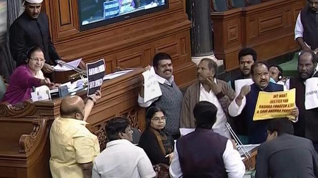 MPs display placards during a protest in the Lok Sabha in New Delhi. (PTI File Photo) MPs display placards during a protest in the Lok Sabha in New Delhi. (PTI File Photo)