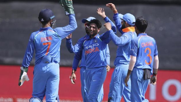 Kuldeep Yadav, centre, and teammates celebrate the wicket of Aiden Markram during the third ODI between South Africa and India in Cape Town. Follow highlights of India vs South Africa, 3rd ODI in Cape Town here.(AP)