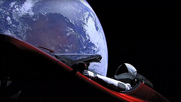 An image from the SpaceX livestream shows "Starman" sitting in SpaceX CEO Elon Musk's cherry red Tesla roadster after the Falcon Heavy rocket delivered it into orbit around the Earth (AFP)