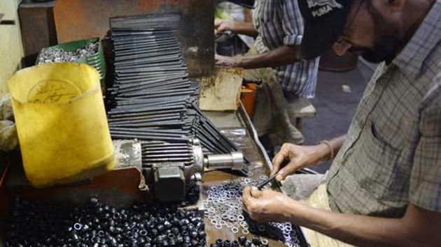 A man works at a cycle spare parts factory in Ludhiana. The government’s earlier definition considered manufacturers with Rs 25 lakh investment in plant and machinery as micro enterprises and those with investments between Rs 25 lakh and Rs 5 crore were small enterprises. (AFP File Photo) A man works at a cycle spare parts factory in Ludhiana. The government’s earlier definition considered manufacturers with Rs 25 lakh investment in plant and machinery as micro enterprises and those with investments between Rs 25 lakh and Rs 5 crore were small enterprises. (AFP File Photo)