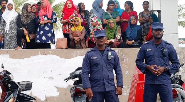 Security forces stand outside the Maldivian Democratic Party (MDP) office in capital Male, on February 7.(REUTERS)