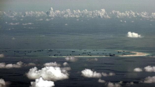 An aerial photo taken though the window of a plane shows the alleged on-going land reclamation by China in the South China Sea.(Reuters File Photo)