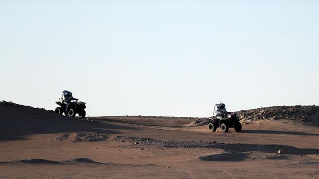AMADEE-18 Mars simulation mission members ride all-terrain vehicles in the Dhofar desert in southern Oman. While public and private ventures are racing towards Mars and astronauts are learning valuable spacefaring skills on the International Space Station — and the U.S. is using virtual reality to train scientists — the majority of work for interplanetary expeditions is still being done on some of Earth’s most forbidding spots. (Karim Sahib / AFP) AMADEE-18 Mars simulation mission members ride all-terrain vehicles in the Dhofar desert in southern Oman. While public and private ventures are racing towards Mars and astronauts are learning valuable spacefaring skills on the International Space Station — and the U.S. is using virtual reality to train scientists — the majority of work for interplanetary expeditions is still being done on some of Earth’s most forbidding spots. (Karim Sahib / AFP)