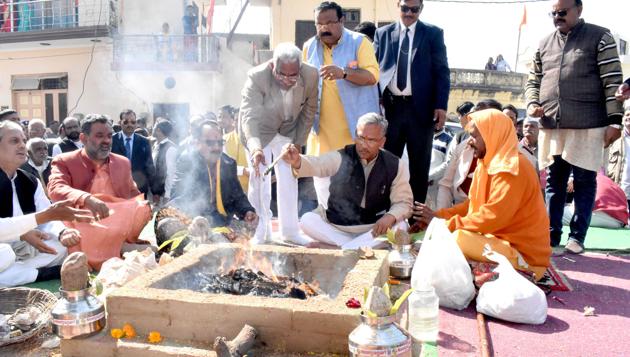 Chief minister Trivendra Singh Rawat and BJP legislators, RSS pracharaks, VHP and Bajrang Dal activists during the yagna at the cow memorial pilgrimage centenary function at Katarpur village in Haridwar district of Uttarakhand. (Rameshwar Gaur/HT Photo) Chief minister Trivendra Singh Rawat and BJP legislators, RSS pracharaks, VHP and Bajrang Dal activists during the yagna at the cow memorial pilgrimage centenary function at Katarpur village in Haridwar district of Uttarakhand. (Rameshwar Gaur/HT Photo)