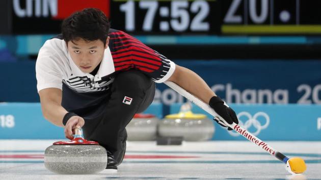 Kijeong Lee of South Korea delivers the stone during the curling practice. (REUTERS) Kijeong Lee of South Korea delivers the stone during the curling practice. (REUTERS)