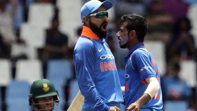 Indian cricket team captain Virat Kohli (centre) celebrates with Yuzvendra Chahal (right), who, alongside Kuldeep Yadav have bamboozled South Africa cricket team batsmen in the ongoing ODI series.(AP)