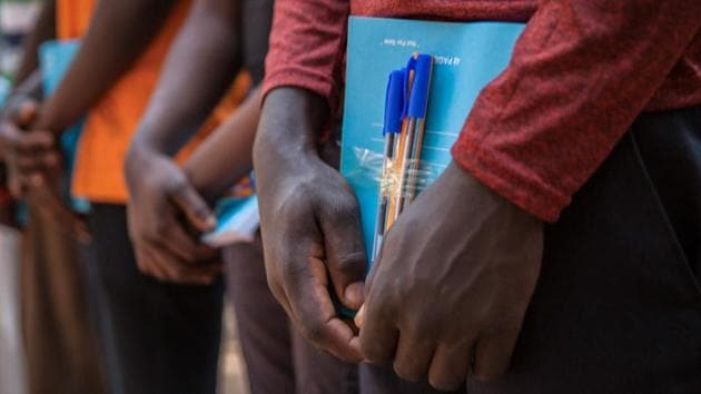Newly released child soldiers receive school supplies as part of a re-integration kit which includes clothing and mosquito nets. “Not all children are forcibly recruited. Many joined armed groups because they feel they had no other option,” said Mdoe. “Our priority for this group – and for children across South Sudan – is to provide the support they need so they are able to see a more promising future.” (Stefanie Glinski / AFP) Newly released child soldiers receive school supplies as part of a re-integration kit which includes clothing and mosquito nets. “Not all children are forcibly recruited. Many joined armed groups because they feel they had no other option,” said Mdoe. “Our priority for this group – and for children across South Sudan – is to provide the support they need so they are able to see a more promising future.” (Stefanie Glinski / AFP)