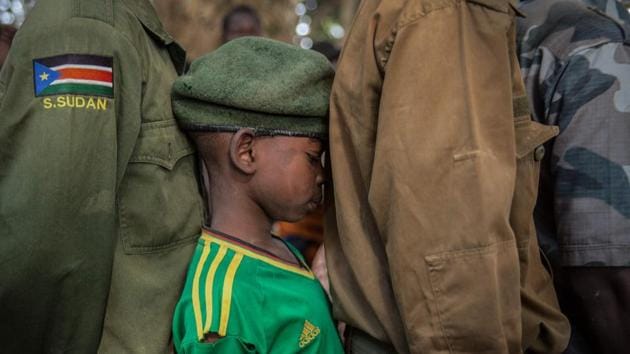 Newly released child soldiers wait for their registration during a release ceremony in Yambio, South Sudan. More than 300 child soldiers, including 87 girls, were released under a programme to help reintegrate them into society, the UN said on February 7, 2018. Conflict erupted little more than two years after South Sudan gained independence from Sudan in 2011, uprooting nearly four million people. (Stefanie Glinski / AFP) Newly released child soldiers wait for their registration during a release ceremony in Yambio, South Sudan. More than 300 child soldiers, including 87 girls, were released under a programme to help reintegrate them into society, the UN said on February 7, 2018. Conflict erupted little more than two years after South Sudan gained independence from Sudan in 2011, uprooting nearly four million people. (Stefanie Glinski / AFP)