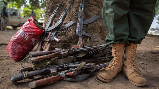 A former child soldier stands next to abandoned rifles during the release ceremony. The South Sudan National Liberation Movement released 215 children, with the remaining 96 freed by the Sudan People’s Liberation Army. The children will be given medical screenings, as well as counselling and psychosocial support, as part of a reintegration programme implemented by UNICEF and other aid groups. (Stefanie Glinski / AFP) A former child soldier stands next to abandoned rifles during the release ceremony. The South Sudan National Liberation Movement released 215 children, with the remaining 96 freed by the Sudan People’s Liberation Army. The children will be given medical screenings, as well as counselling and psychosocial support, as part of a reintegration programme implemented by UNICEF and other aid groups. (Stefanie Glinski / AFP)