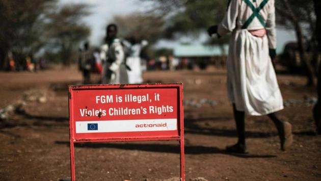A warning sign against FGM in Katabok village. For the Pokot, FGM is intended “to make women clean and as a way of killing the sexual appetite,” says James Apollo Bakan, of the local Vision Care Foundation charity, which works to stop the practice. Men use it to keep their women faithful while they are away herding cattle because it makes sex painful. (Yasuyoshi Chiba / AFP) 