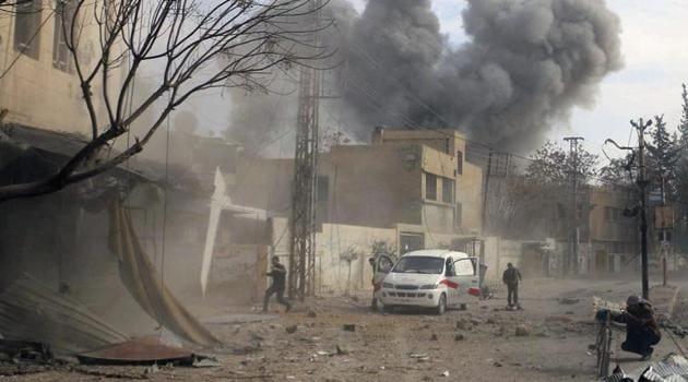 This photo provided by the Syrian Civil Defense White Helmets shows a plume of smoke rises while civil defense workers arrive at the scene of an attack after airstrikes hit a rebel-held suburb near Damascus, Syria, Thursday, Feb. 8, 2018. (AP) This photo provided by the Syrian Civil Defense White Helmets shows a plume of smoke rises while civil defense workers arrive at the scene of an attack after airstrikes hit a rebel-held suburb near Damascus, Syria, Thursday, Feb. 8, 2018. (AP)