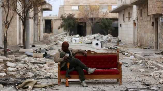 A Turkey-backed Free Syrian Army fighter is seen in the eastern suburbs of al Bab, Syria on February 4, 2018. (Khalil Ashawi / REUTERS) A Turkey-backed Free Syrian Army fighter is seen in the eastern suburbs of al Bab, Syria on February 4, 2018. (Khalil Ashawi / REUTERS)