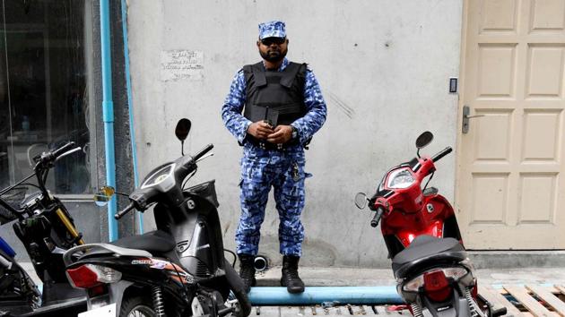 A security personnel stands guard on the streets of the Maldives capital Male.(AFP Photo)