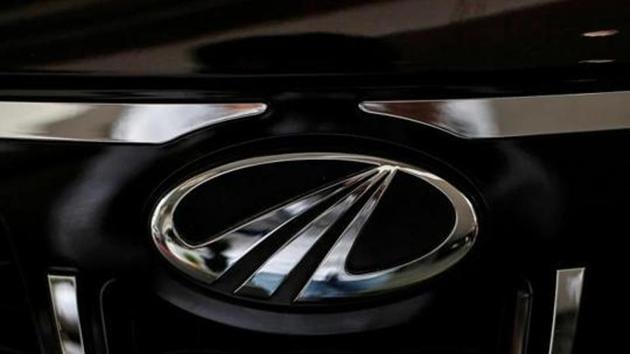 The logo of Mahindra and Mahindra is seen on a car at a showroom in Mumbai.(REUTERS)