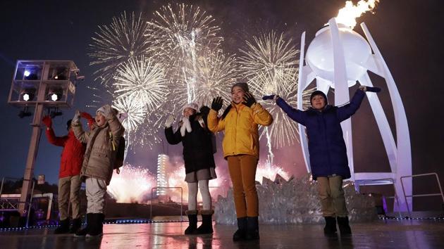 Performers dance as fireworks explode over the opening ceremony of the 2018 Winter Olympic Games. (AP) Performers dance as fireworks explode over the opening ceremony of the 2018 Winter Olympic Games. (AP)