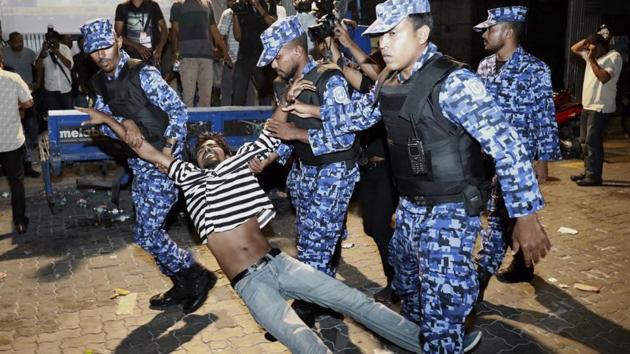 In this February 2 photo, Maldivian police officers detain an opposition protestor demanding the release of political prisoners during a protest in Male, Maldives. (AP Photo) In this February 2 photo, Maldivian police officers detain an opposition protestor demanding the release of political prisoners during a protest in Male, Maldives. (AP Photo)