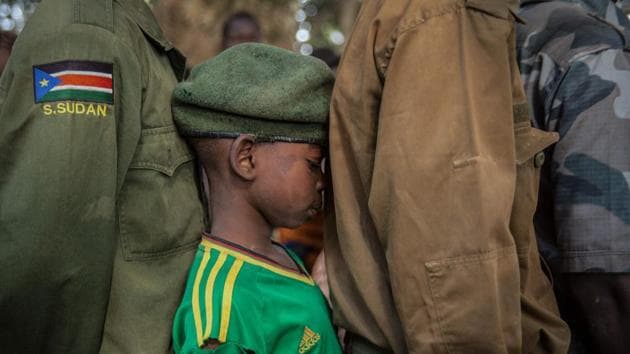 Newly released child soldiers wait in a line for their registration during a release ceremony of more than 300 child soldiers in Yambio, South Sudan, on February 7, 2018. (Stefanie Glinski / AFP) Newly released child soldiers wait in a line for their registration during a release ceremony of more than 300 child soldiers in Yambio, South Sudan, on February 7, 2018. (Stefanie Glinski / AFP)