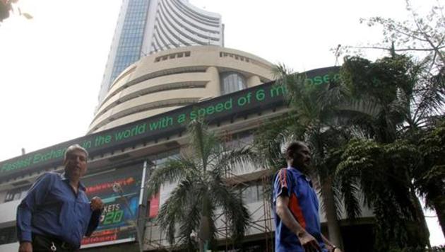 People walk past the Bombay Stock Exchange (BSE) in Mumbai.(HT File Photo)