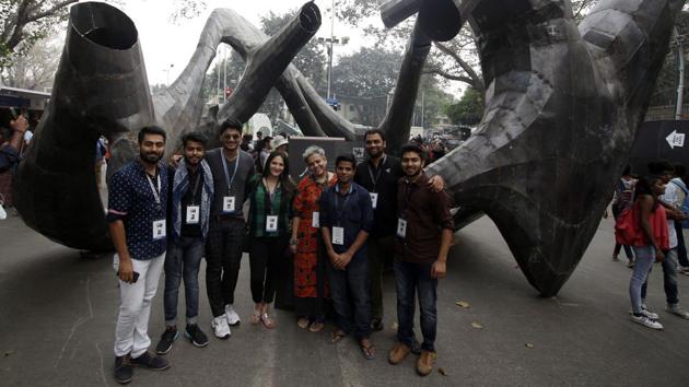 A team of volunteers pose in front of an installation at Kala Ghoda.(Hemanshi Kamani/HT)