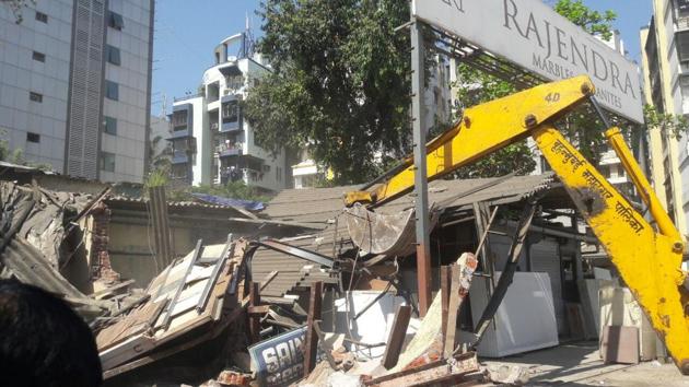 About 50 per cent of the road was encroached by some marble shops by stocking marbles on extensions, which were cleared. (HT) About 50 per cent of the road was encroached by some marble shops by stocking marbles on extensions, which were cleared. (HT)