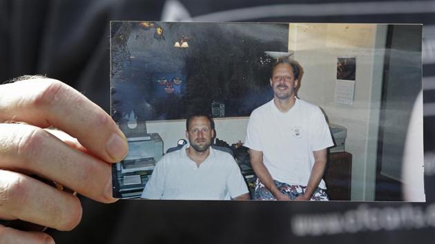 In this Oct. 2, 2017 file photo, Eric Paddock holds a photo of himself, at left, and his brother, Stephen Paddock, at right, outside his home in Orlando, Florida. An autopsy found Las Vegas shooter Stephen Paddock had anti-anxiety drugs in his system but was not under the influence of them and was otherwise healthy. (AP Photo) In this Oct. 2, 2017 file photo, Eric Paddock holds a photo of himself, at left, and his brother, Stephen Paddock, at right, outside his home in Orlando, Florida. An autopsy found Las Vegas shooter Stephen Paddock had anti-anxiety drugs in his system but was not under the influence of them and was otherwise healthy. (AP Photo)