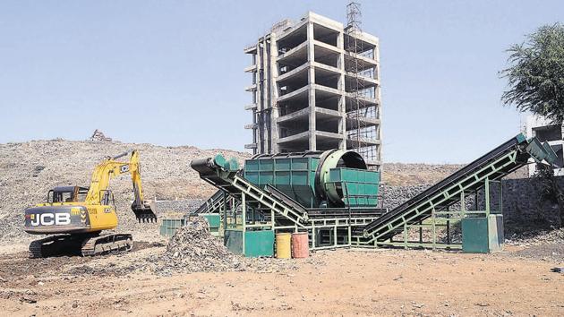 The work of processing waste at Aadharwadi dumping ground in Kalyan (West) will begin soon. (HT FILE) The work of processing waste at Aadharwadi dumping ground in Kalyan (West) will begin soon. (HT FILE)
