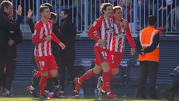 Atletico Madrid’s Antoine Griezmann celebrates scoring their only goal against Malaga in La Liga on Saturday. (Reuters) Atletico Madrid’s Antoine Griezmann celebrates scoring their only goal against Malaga in La Liga on Saturday. (Reuters)
