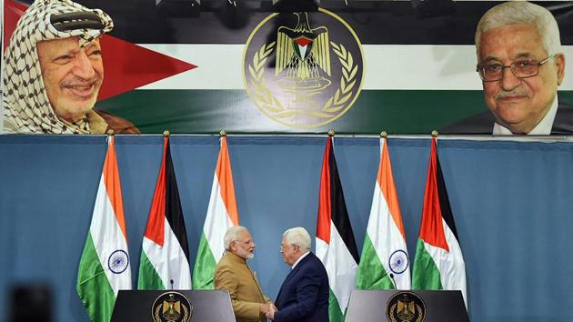 Prime Minister Narendra Modi and Palestinian President Mahmoud Abbas shake hands after the two sides signed agreements worth around $50 million during the joint press meet, at Ramallah, in Palestine on Saturday. (PTI Photo) Prime Minister Narendra Modi and Palestinian President Mahmoud Abbas shake hands after the two sides signed agreements worth around $50 million during the joint press meet, at Ramallah, in Palestine on Saturday. (PTI Photo)