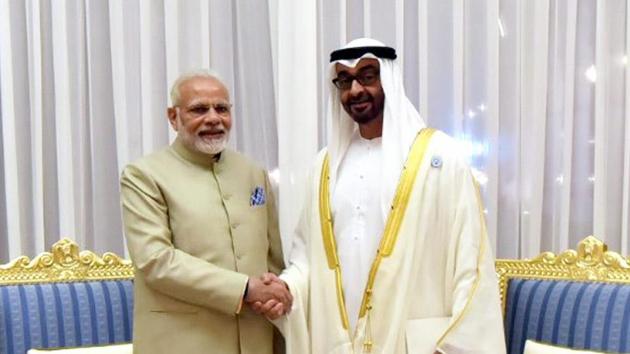 Prime Minister Narendra Modi shakes talks with the Crown Prince of Abu Dhabi, Deputy Supreme Commander of UAE Armed Forces, General Sheikh Mohammed Bin Zayed Al Nahyan, in Abu Dhabi, on Saturday.(PTI Photo)