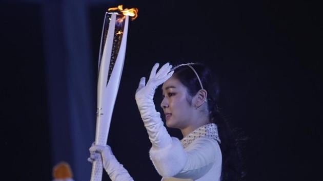 Former figure skater Kim Yuna Kim of South Korea prepares to light the cauldron at the 2018 Winter Olympics.(REUTERS)