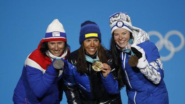 Gold medallist Charlotte Kalla of Sweden, silver medallist Marit Bjoergen of Norway and bronze medalist Krista Parmakoski of Finland on the podium. after the women’s skiathlon cross country race. (REUTERS) Gold medallist Charlotte Kalla of Sweden, silver medallist Marit Bjoergen of Norway and bronze medalist Krista Parmakoski of Finland on the podium. after the women’s skiathlon cross country race. (REUTERS)