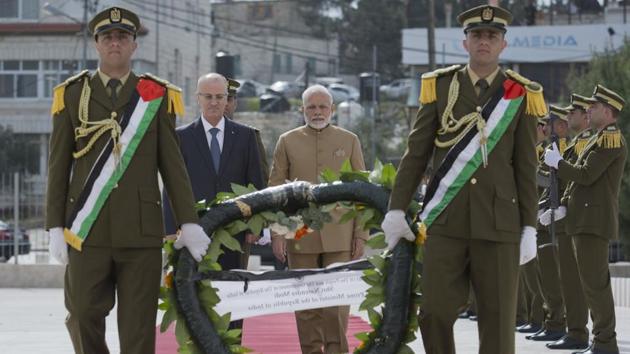 Palestinian Prime Minister Rami Hamdallah, left, escorts PM Narendra Modi while he lays a wreath on Arafat's grave in Ramallah. (AP Photo) Palestinian Prime Minister Rami Hamdallah, left, escorts PM Narendra Modi while he lays a wreath on Arafat's grave in Ramallah. (AP Photo)