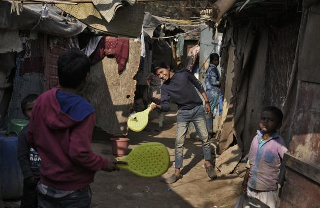 DELHI: Delhi has more green spaces, if you’re from a certain socio-economic class. “There is only one large ground in our area and kids from miles come to play there. I don’t let my son go; it’s a hazard,” says Sushma Dahiya, 29, a resident of Mundka, an industrial neighbourhood in West Delhi. In the slums, there isn’t even that. So here, kids play a game that doesn’t exist — with table tennis paddles and a shuttlecock — in the narrow lanes between the hutments in Ghaffar Manzil Jamia Nagar. (Burhaan Kinu / HT PHOTO)