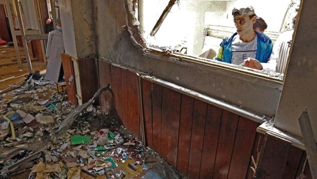 A Libyan youth inspects the interior of a mosque in Benghazi on February 9, 2018, after it was hit with a twin bomb attack. (AFP) A Libyan youth inspects the interior of a mosque in Benghazi on February 9, 2018, after it was hit with a twin bomb attack. (AFP)