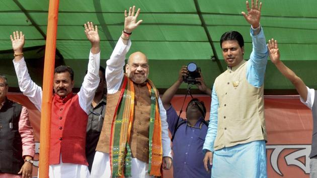 BJP national president Amit Shah waves at a crowd during an election campaign in Agartala, Tripura, on Sunday. (PTI Photo) BJP national president Amit Shah waves at a crowd during an election campaign in Agartala, Tripura, on Sunday. (PTI Photo)