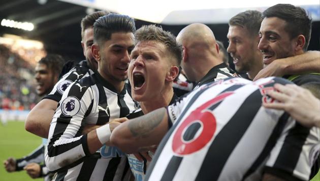 Newcastle United's Matt Ritchie (C) celebrates with teammates after scoring his side's goal during their English Premier League match against Manchester United at St James' Park on Sunday. (AP) Newcastle United's Matt Ritchie (C) celebrates with teammates after scoring his side's goal during their English Premier League match against Manchester United at St James' Park on Sunday. (AP)