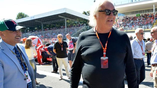 (FILES) In this file photo taken on September 06, 2015 Flavio Briatore walks ahead of the Italian Formula One Grand Prix at the Autodromo Nazionale circuit in Monza. The Benetton and Renault F1 racing teams was sentenced on appeal to 18 months in jail for tax evasion in connection with his luxury yacht.(AFP)
